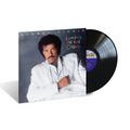 Lionel Richie's 'Dancing on the Ceiling' vinyl record album, showing the front cover with the artist in a white jacket and the black vinyl record partially pulled out.