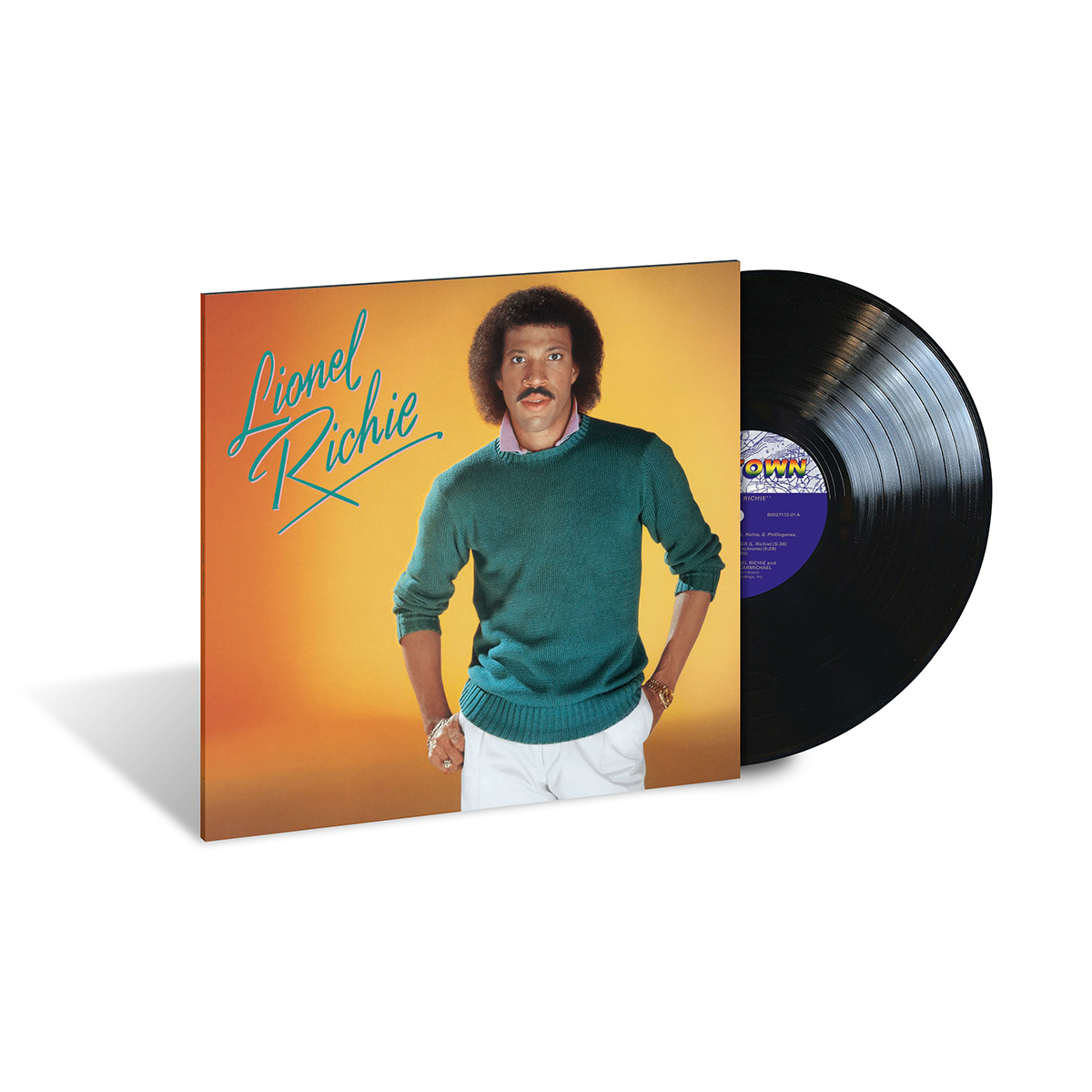 A vinyl record album cover featuring Lionel Richie in a green sweater against a yellow and orange background. The album title is displayed in stylized text.