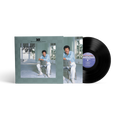 Vinyl record with cover featuring Lionel Richie sitting in a chair