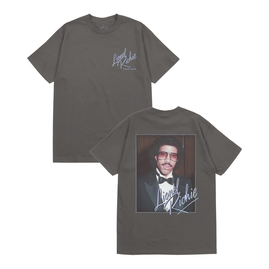 Classic fitting unisex t-shirt in black featuring "Lionel Richie Tour 2026" design on the front chest and a Lionel Richie portrait printed on the back